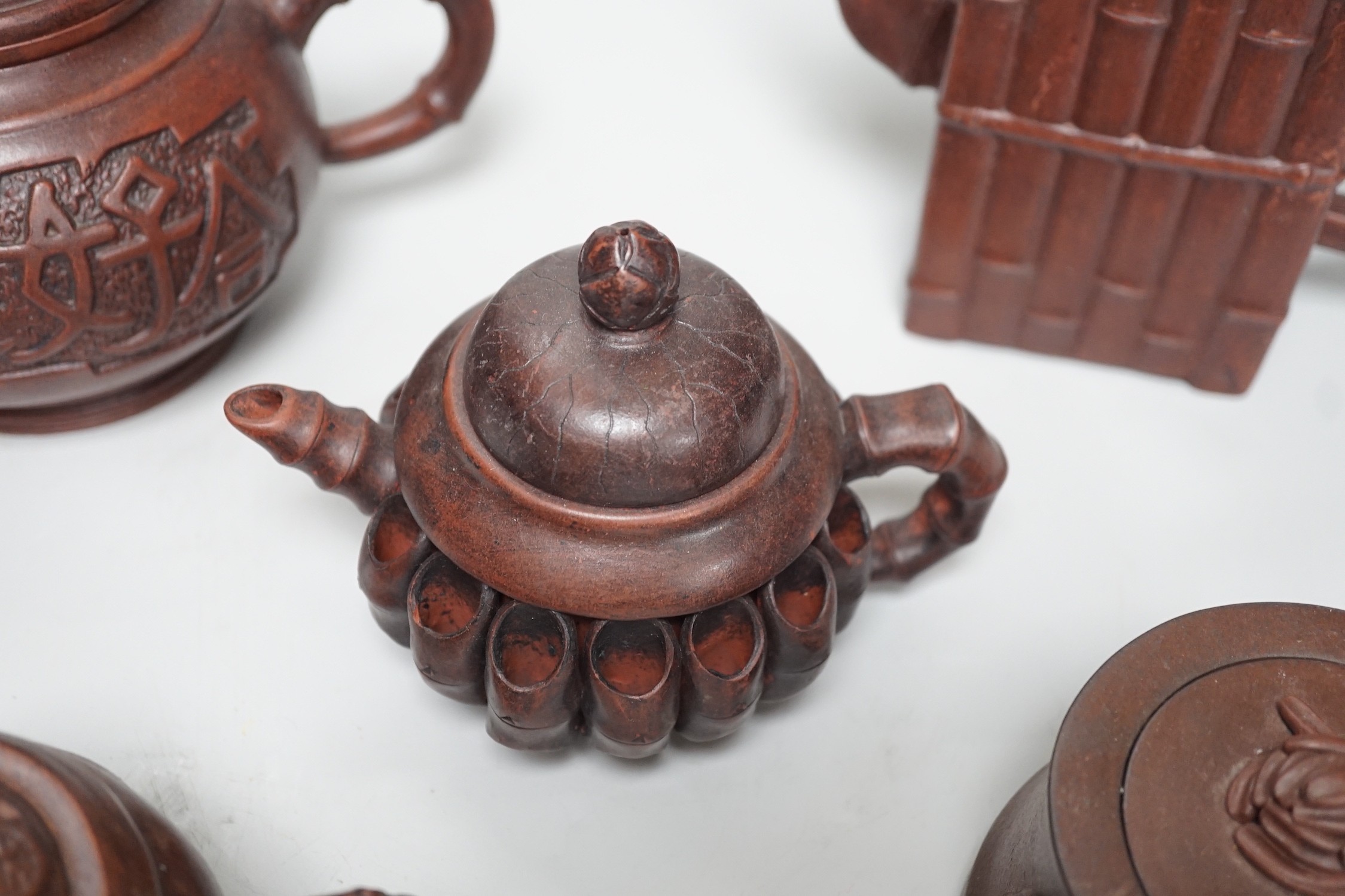 A collection of five Chinese Yixing teapots, tallest 6.5cms high